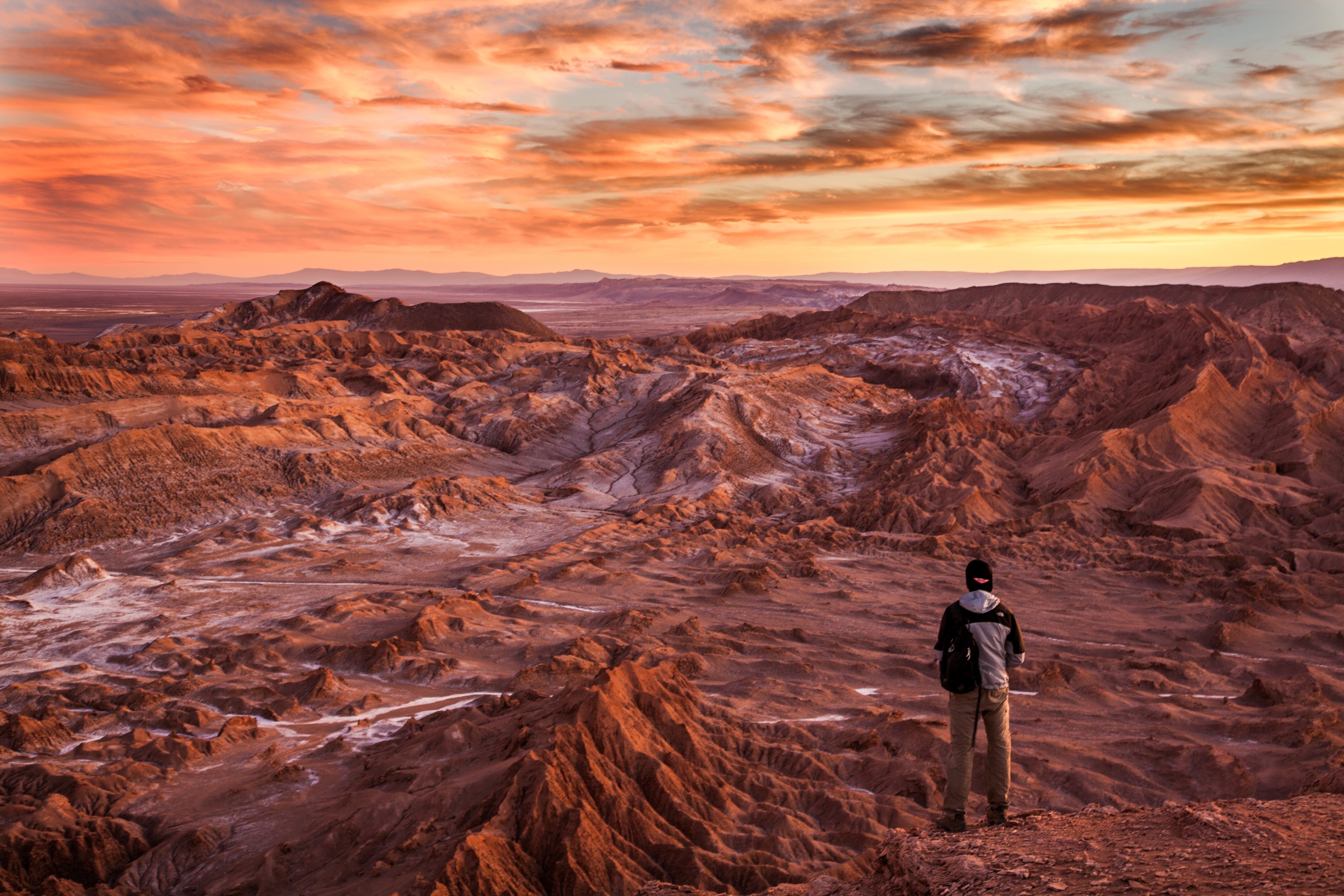 a man looking at a beautiful landscape